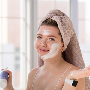 A lady with cleanser on her face agreeing that a good skin cleanser is important