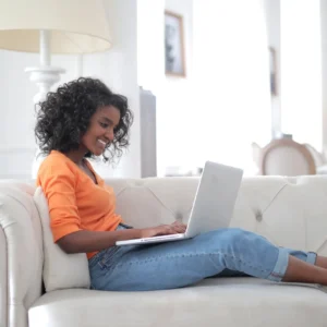 Lady sat on her sofa working from home