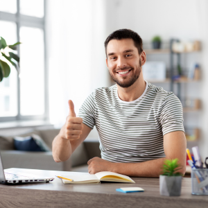 Man looking happy and enjoying his second job from home