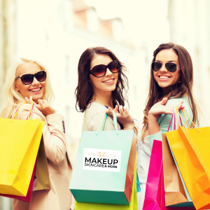 Lady smiling looking happy with bags full of Avon Products